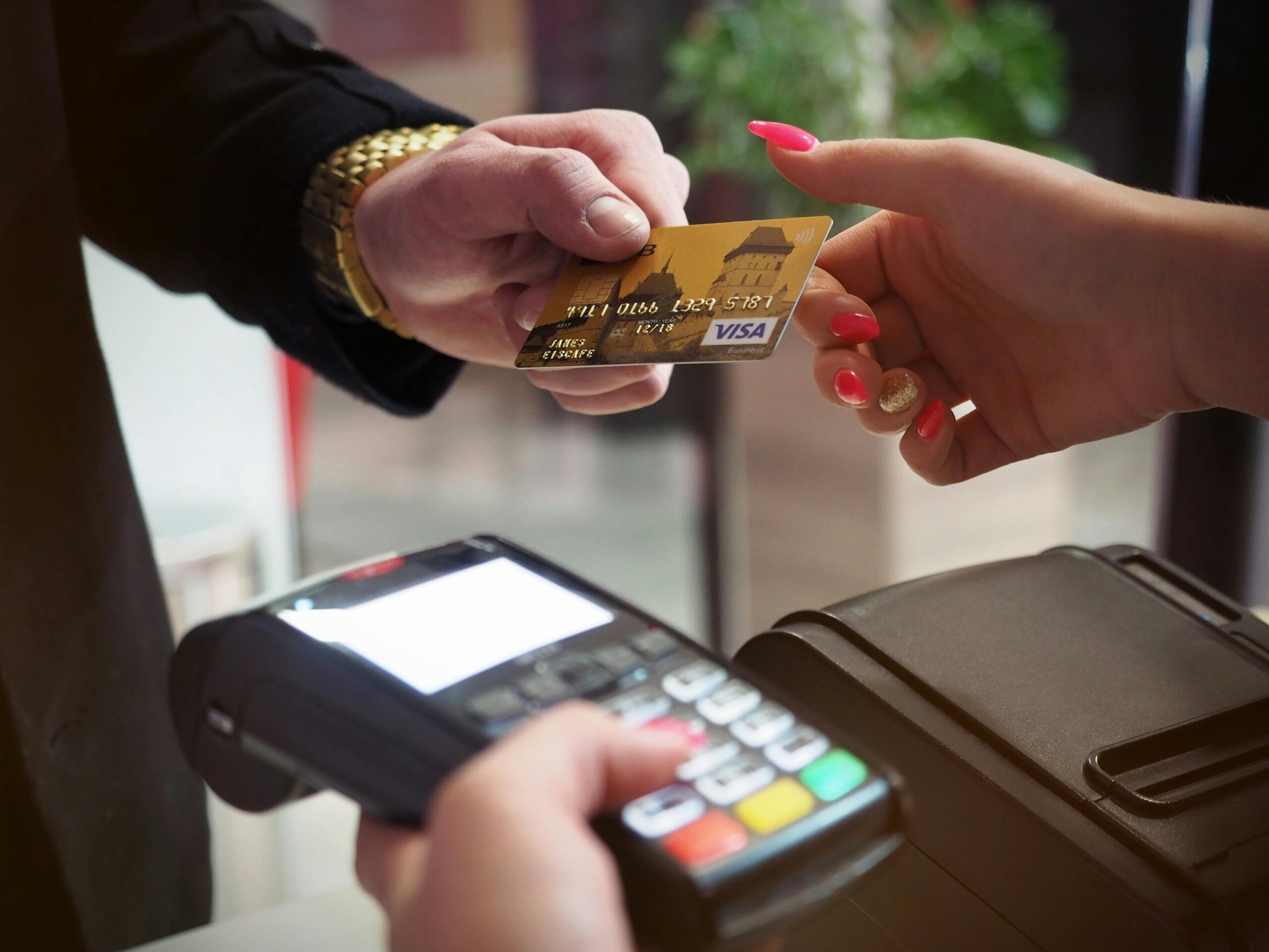 Home Close-up of a credit card payment being processed at a POS terminal.